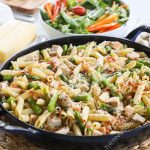 Garlic Butter Pasta in Skillet with bacon and asparagus
